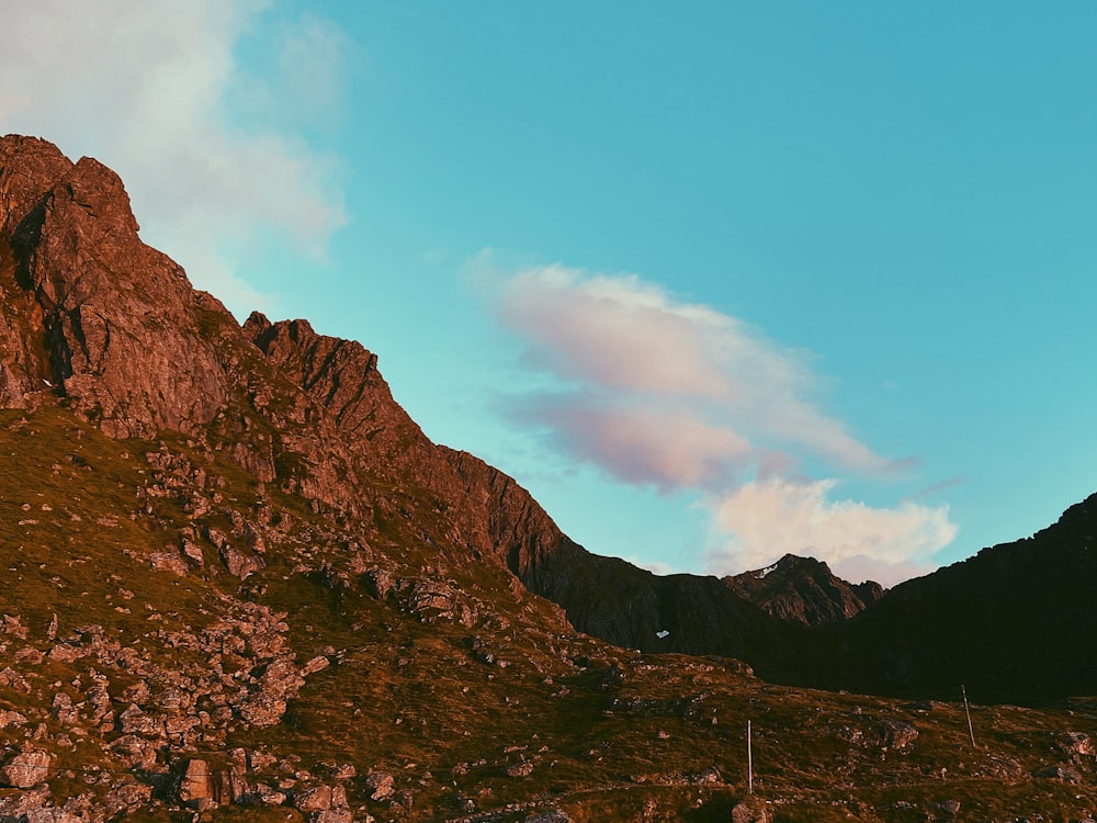 brown rocky mountain under blue sky during daytime