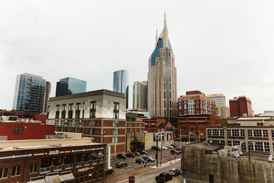 cars parked on side of road near high rise buildings during daytime in Nashville United States