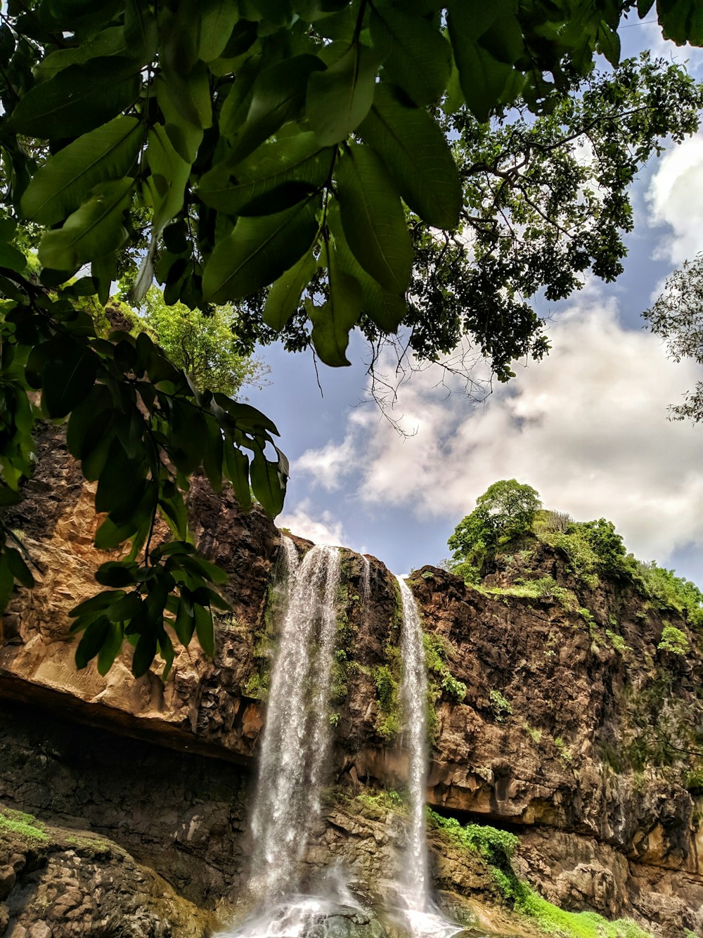 waterfalls in the middle of the forest