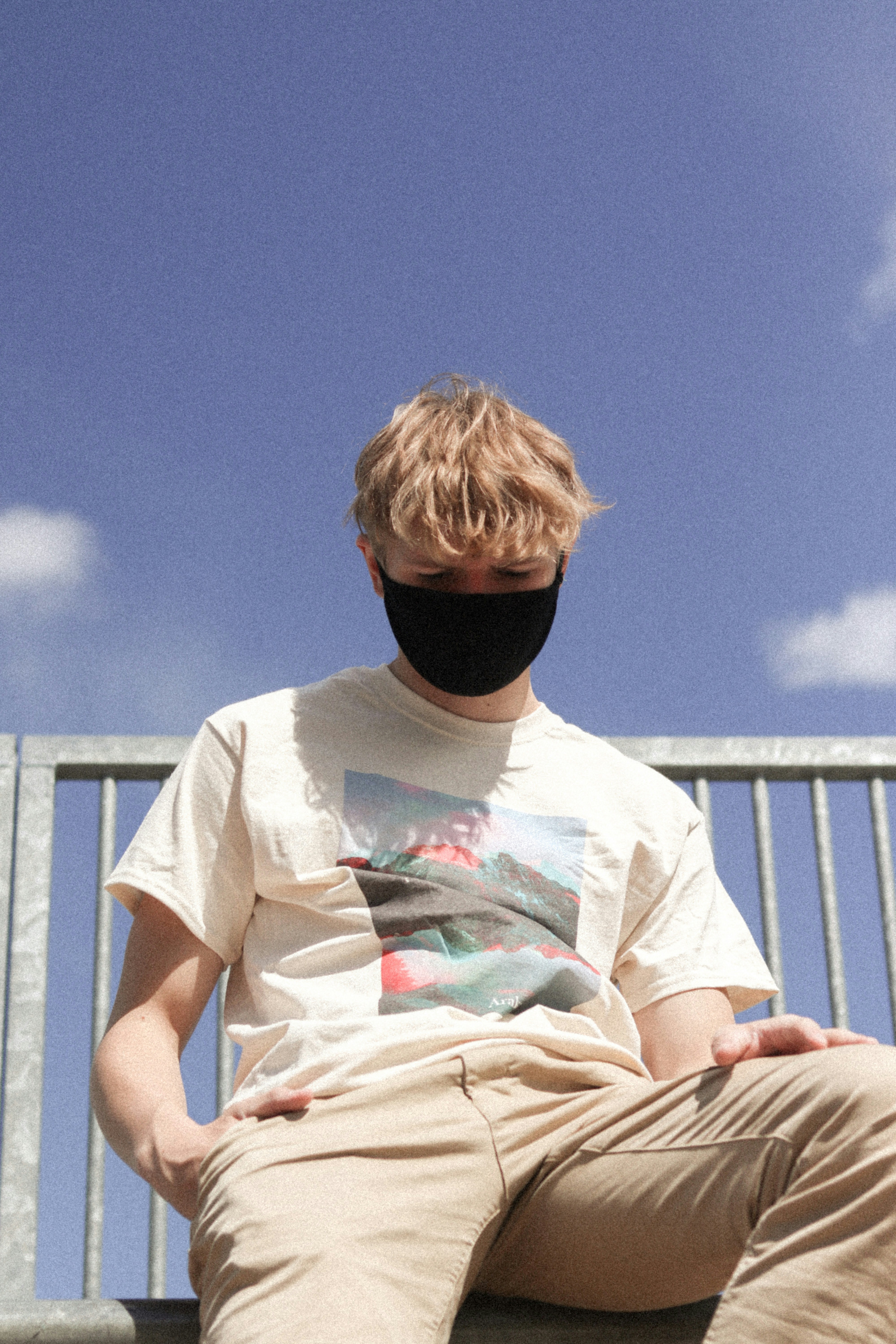 man in white crew neck t-shirt wearing black cap