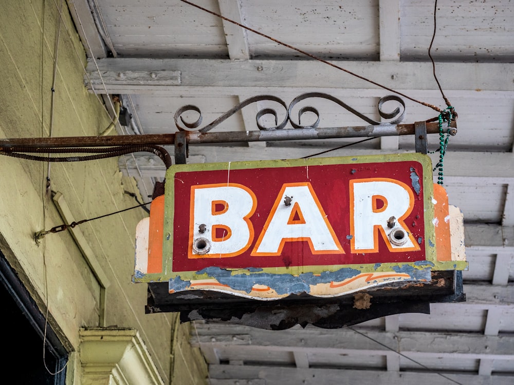 a sign hanging from the side of a building