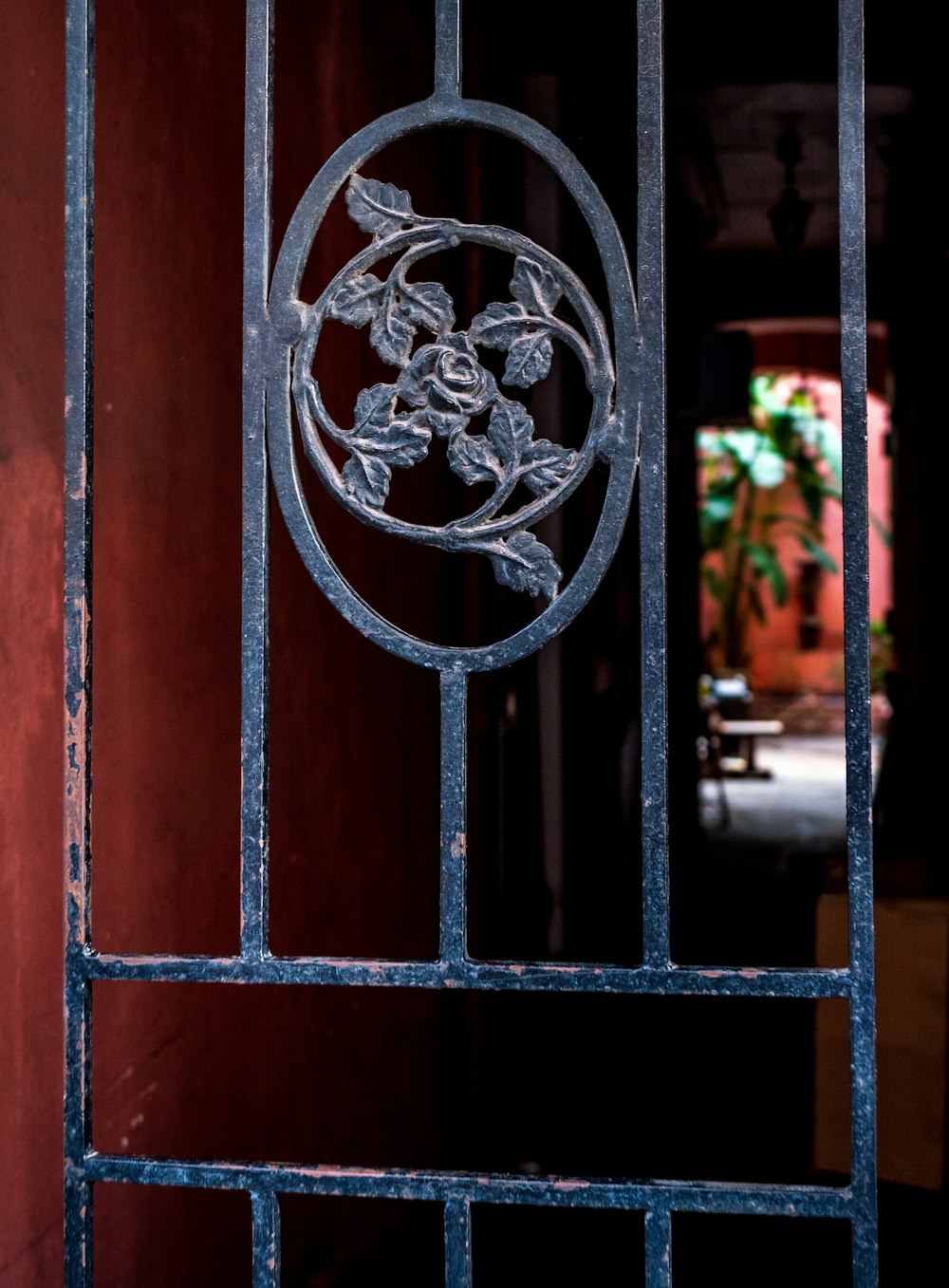 black metal gate with red metal gate