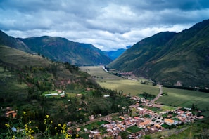 green mountains under white clouds during daytime