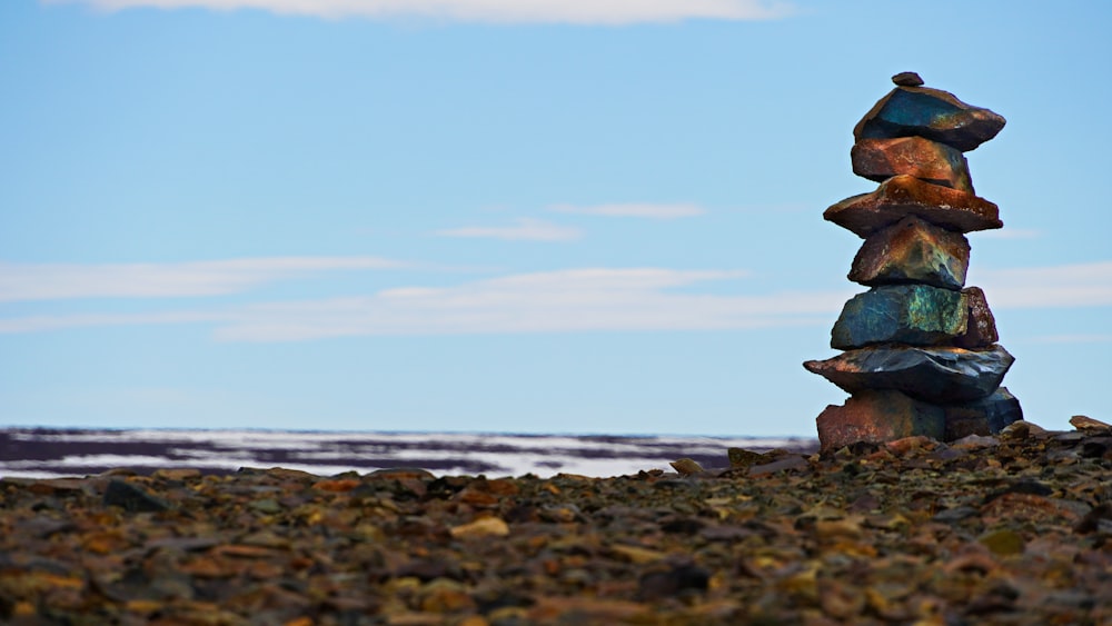 brown rock formation near sea during daytime