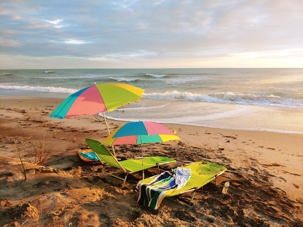 yellow and green umbrella on beach during daytime