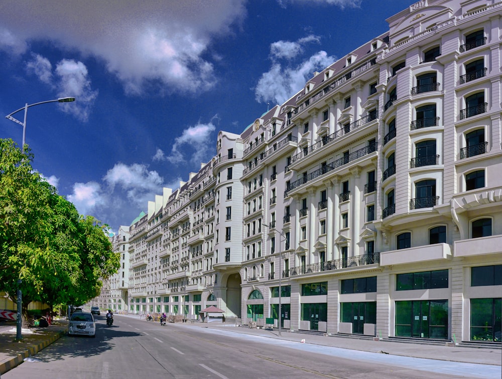 white concrete building near green trees during daytime