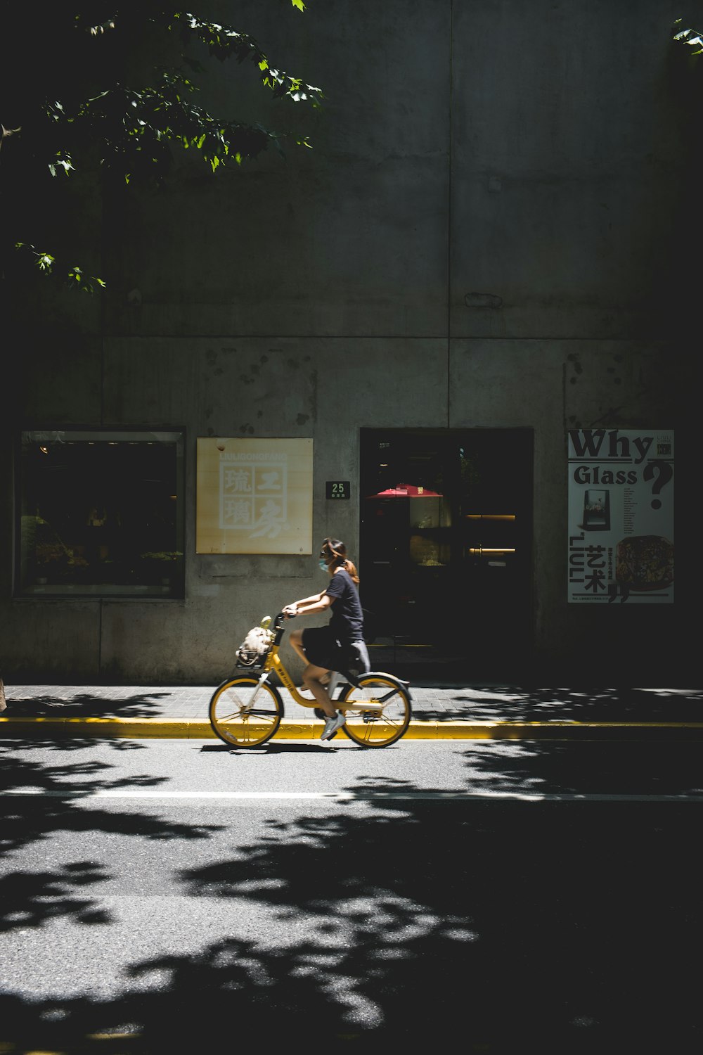 man in black shirt riding bicycle on road during nighttime