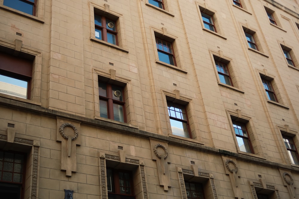 brown concrete building with windows