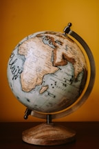 brown and white desk globe
