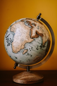 brown and white desk globe