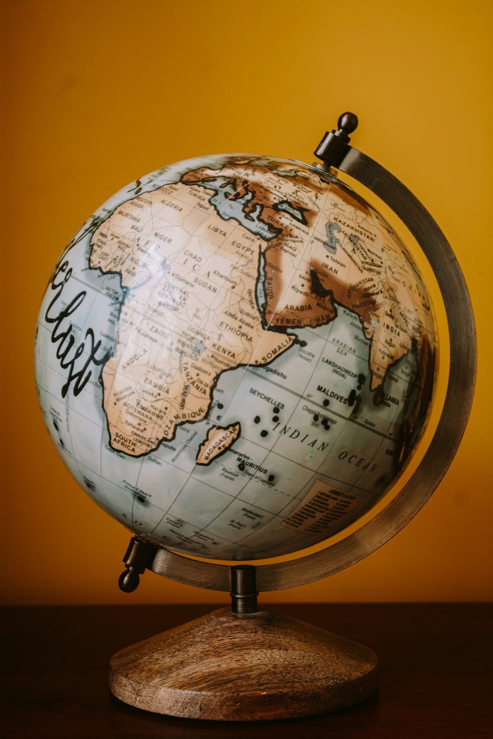 brown and white desk globe