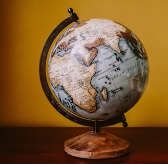 white and brown desk globe