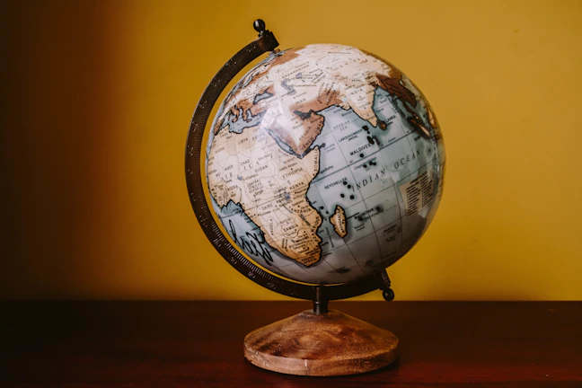 white and brown desk globe
