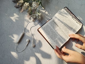 person holding white box showing back content