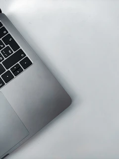 Side view of a pre-owned laptop with a clean keyboard and screen.