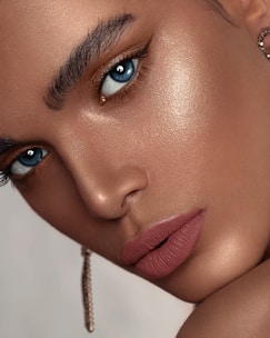 woman with red lipstick and gold hoop earrings