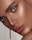 woman with red lipstick and gold hoop earrings