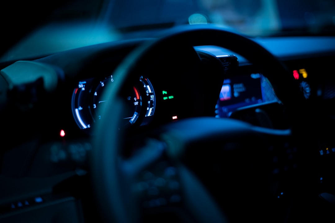 black car steering wheel and dashboard