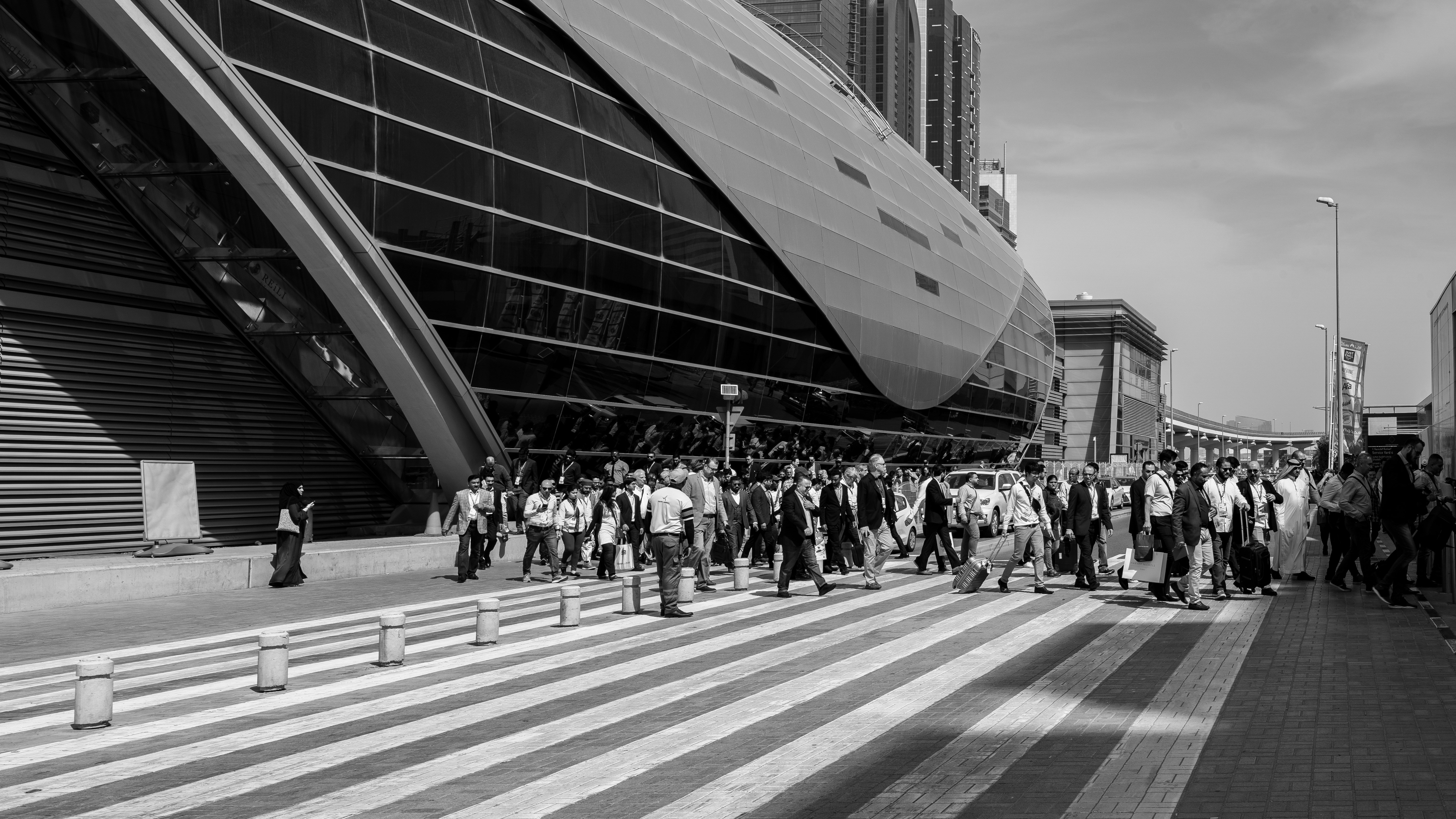grayscale photo of people walking on street