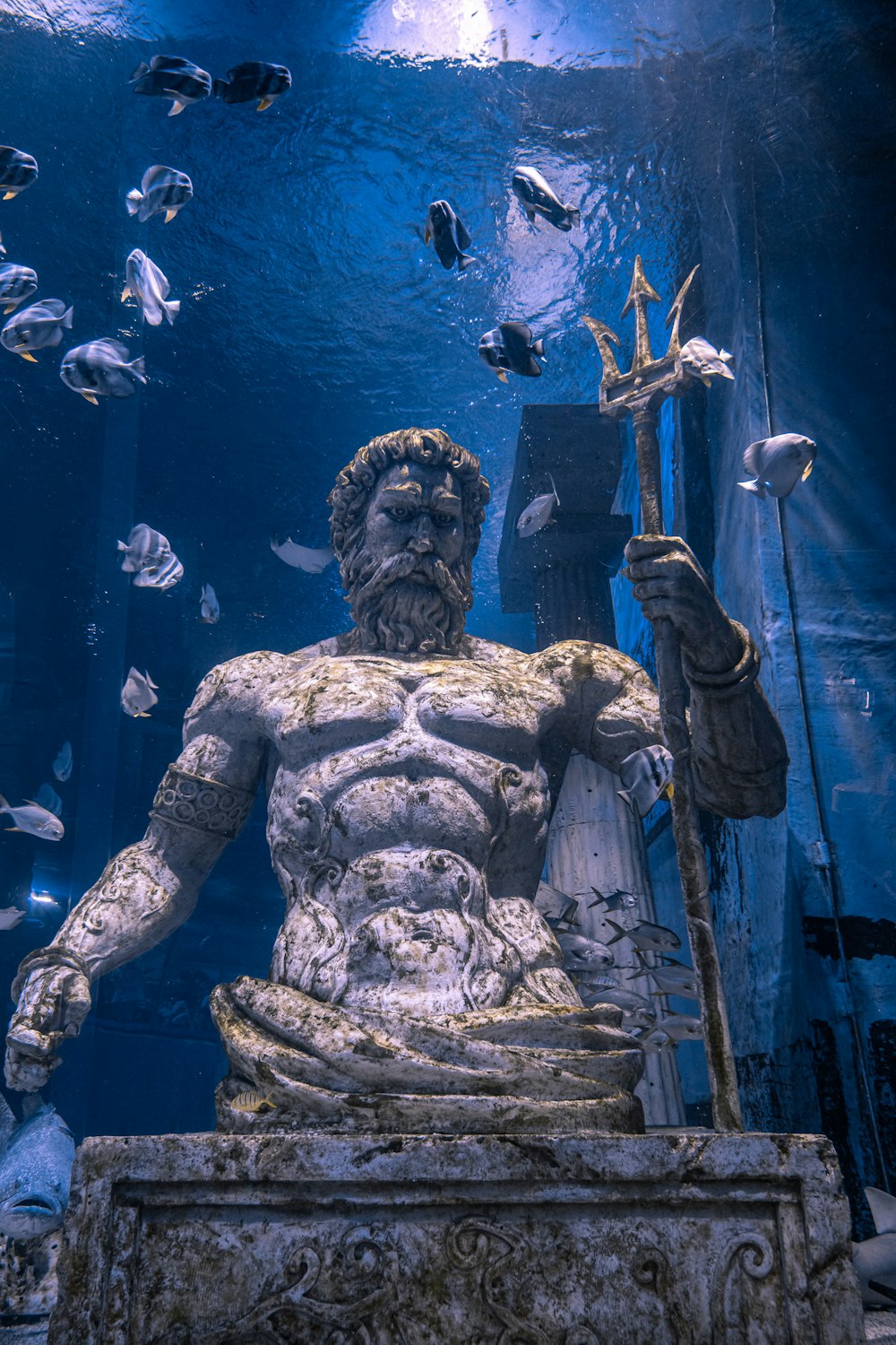 man in black shorts statue