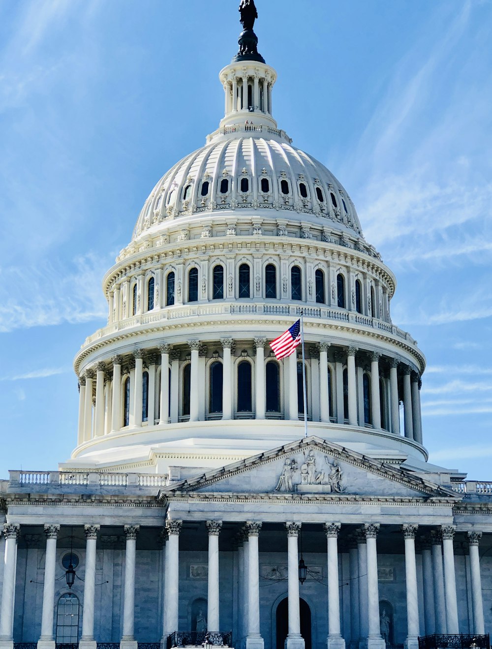 white concrete dome building under blue sky during daytime