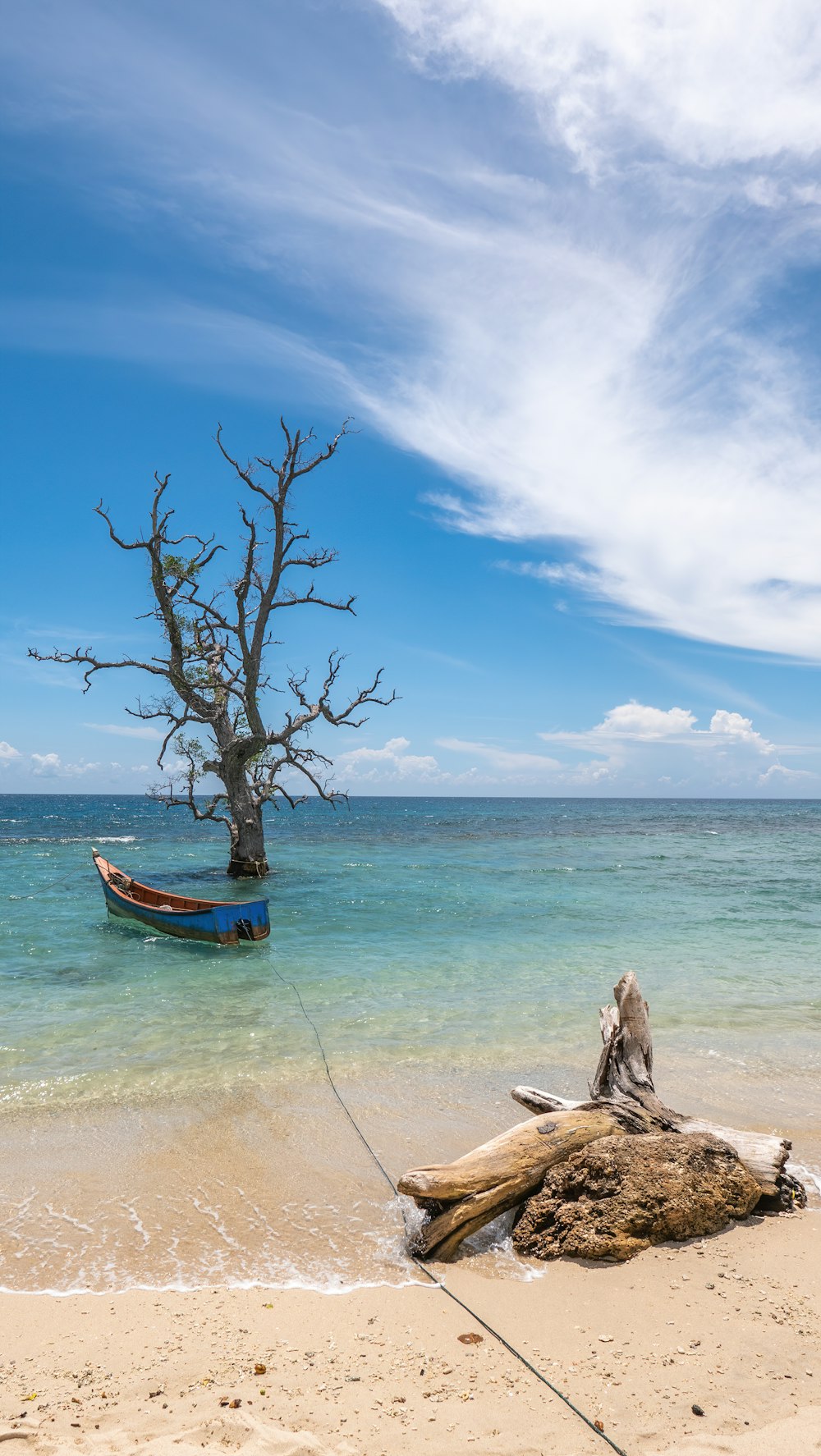 brown wooden boat on beach during daytime