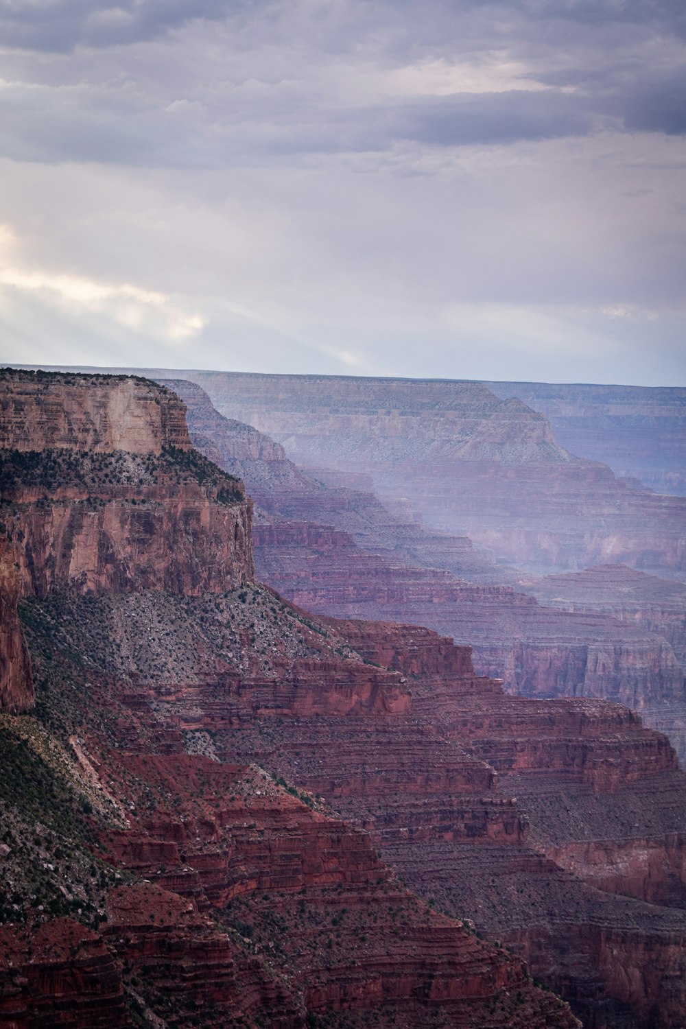 brown rocky mountain under white sky during daytime