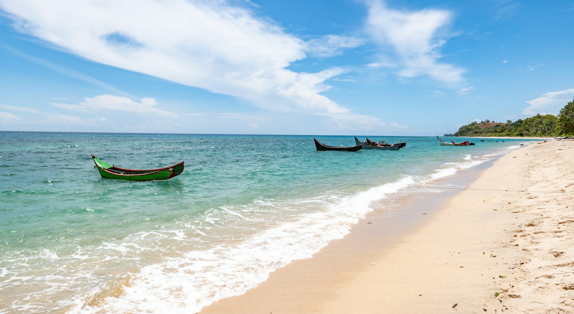 Image of wooden boat on beach of Aceh, Indonesia