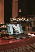 macbook pro on brown wooden table