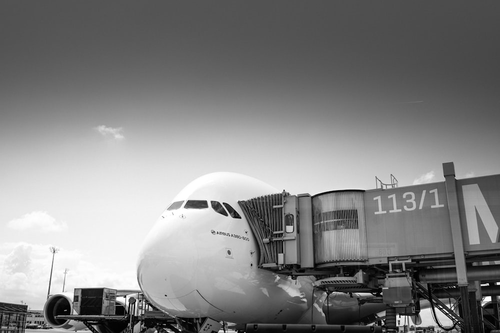 airplane in grayscale photography during daytime