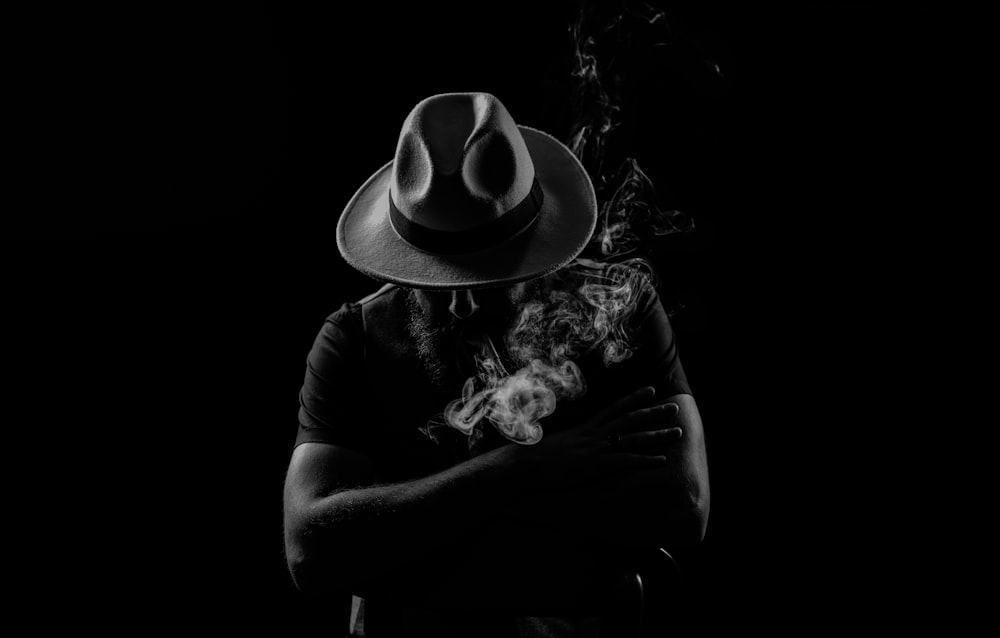 grayscale photo of person wearing cowboy hat