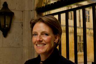 Satisfied customer standing proudly next to their newly installed automatic gate.