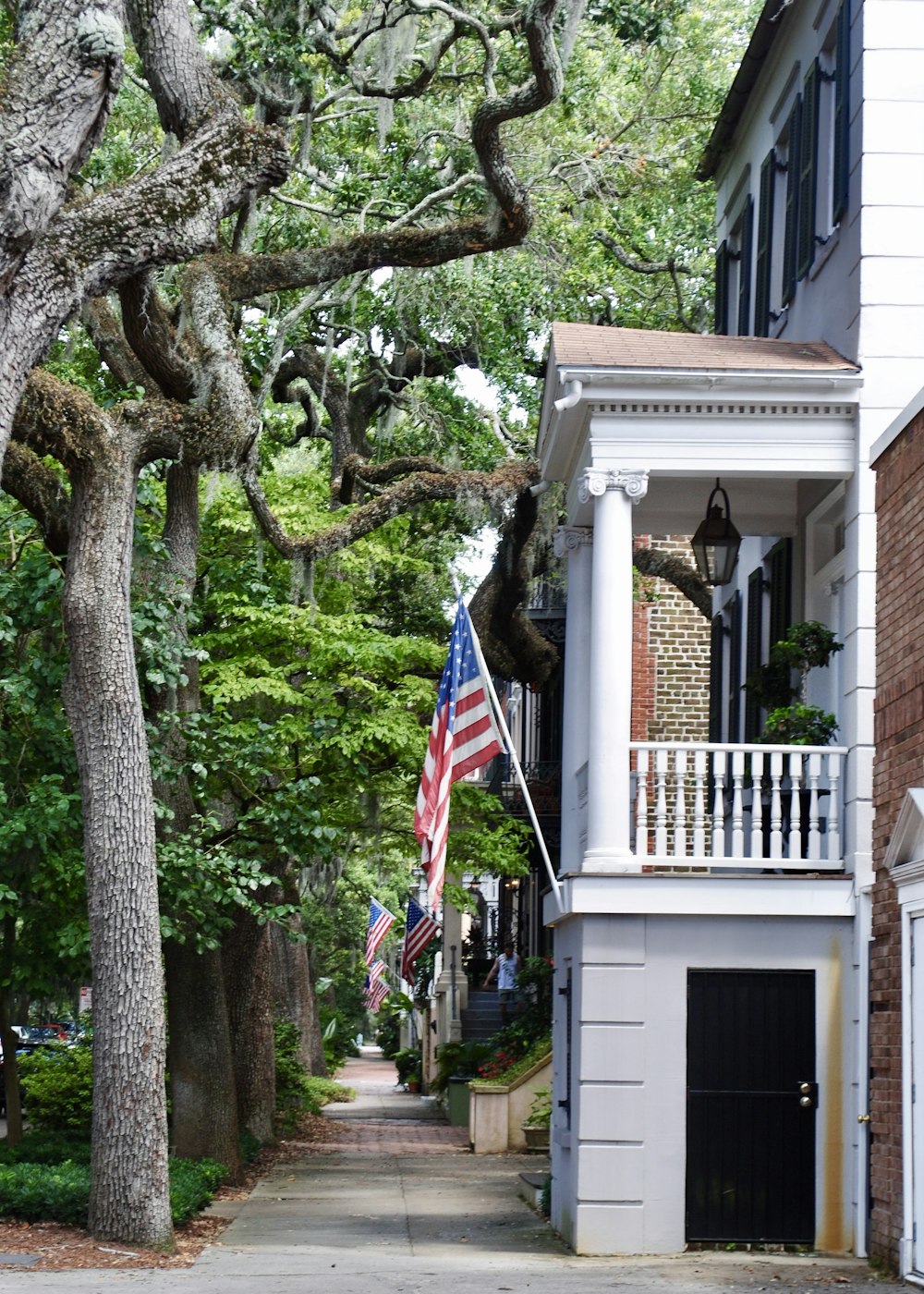 us a flag on white wooden house