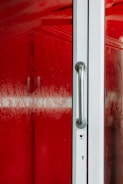 Close-up of a spotless glass door polished to remove scratches and mineral deposits.