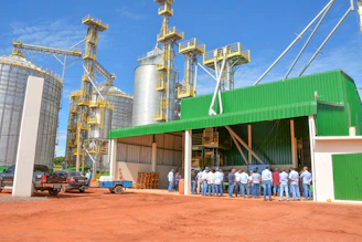 people standing near green and white building during daytime