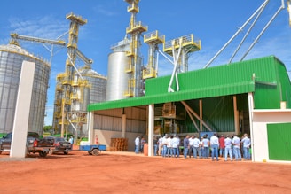 people standing near green and white building during daytime
