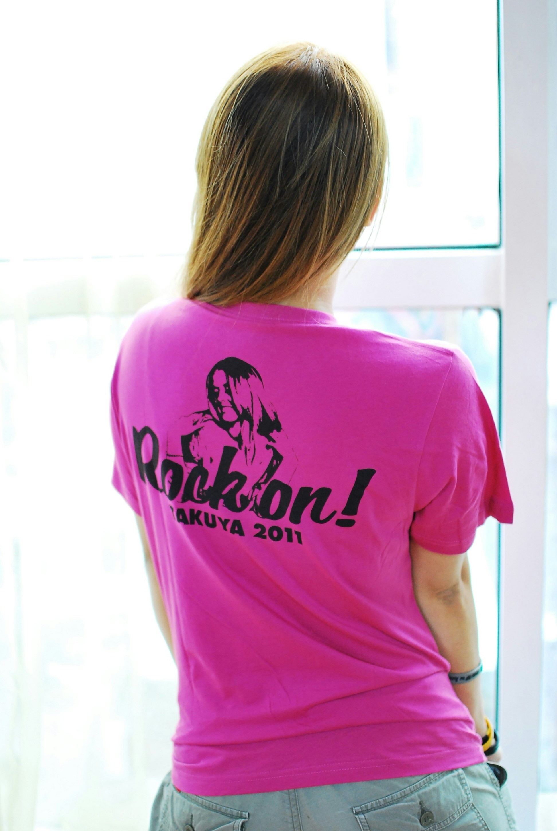 woman in green and white crew neck t-shirt