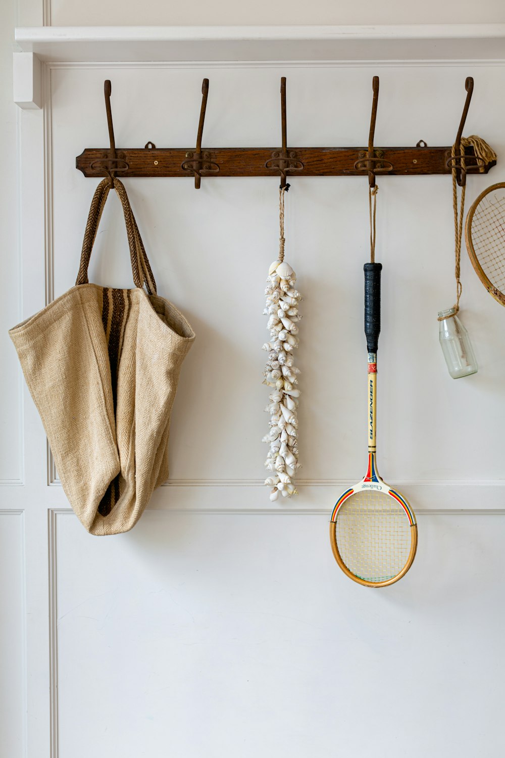 brown and black wooden wall mounted rack