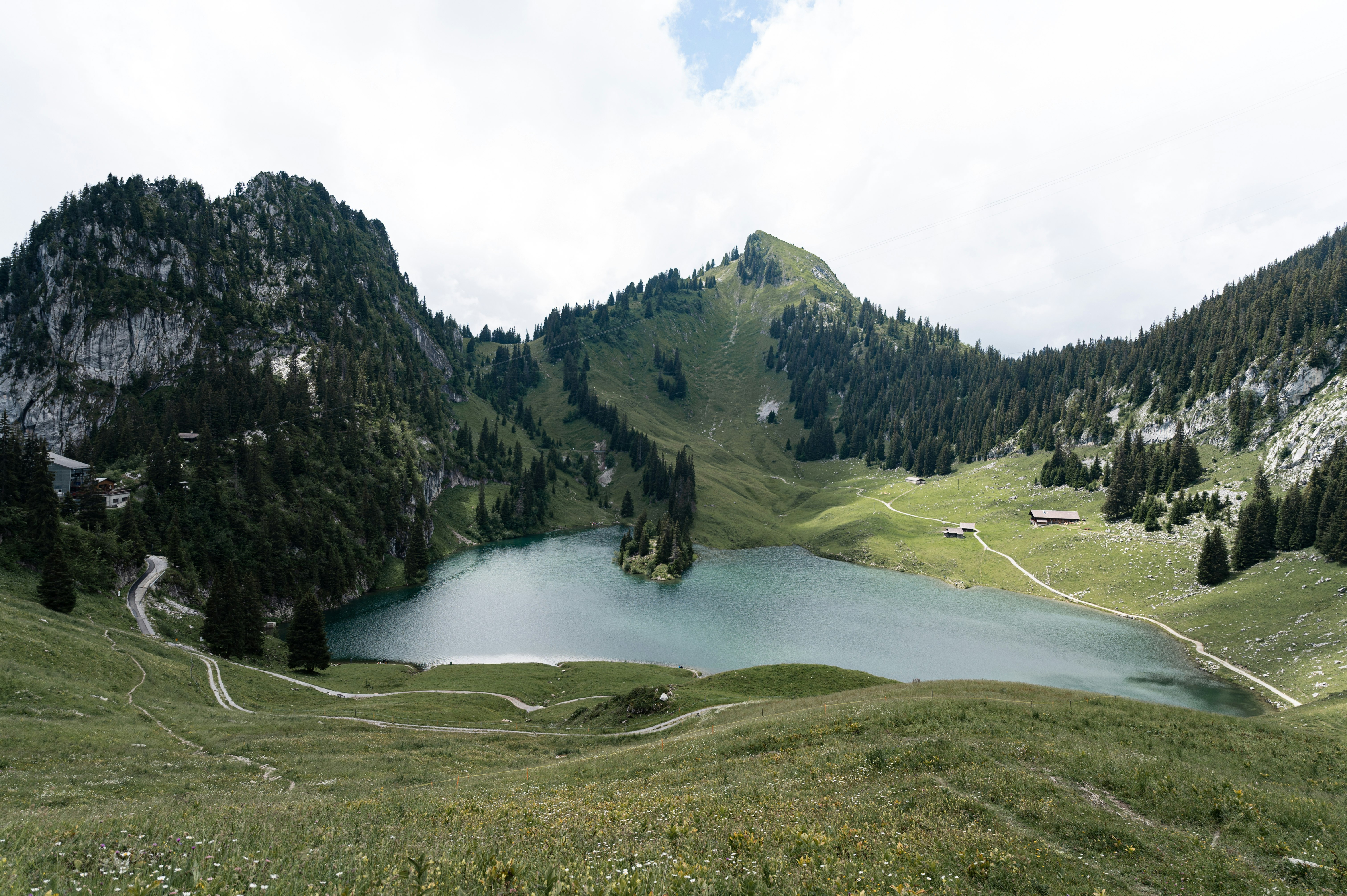 green mountains near river during daytime