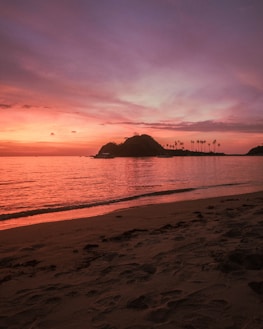A serene beach sunset captured during a peaceful evening on a tropical island.