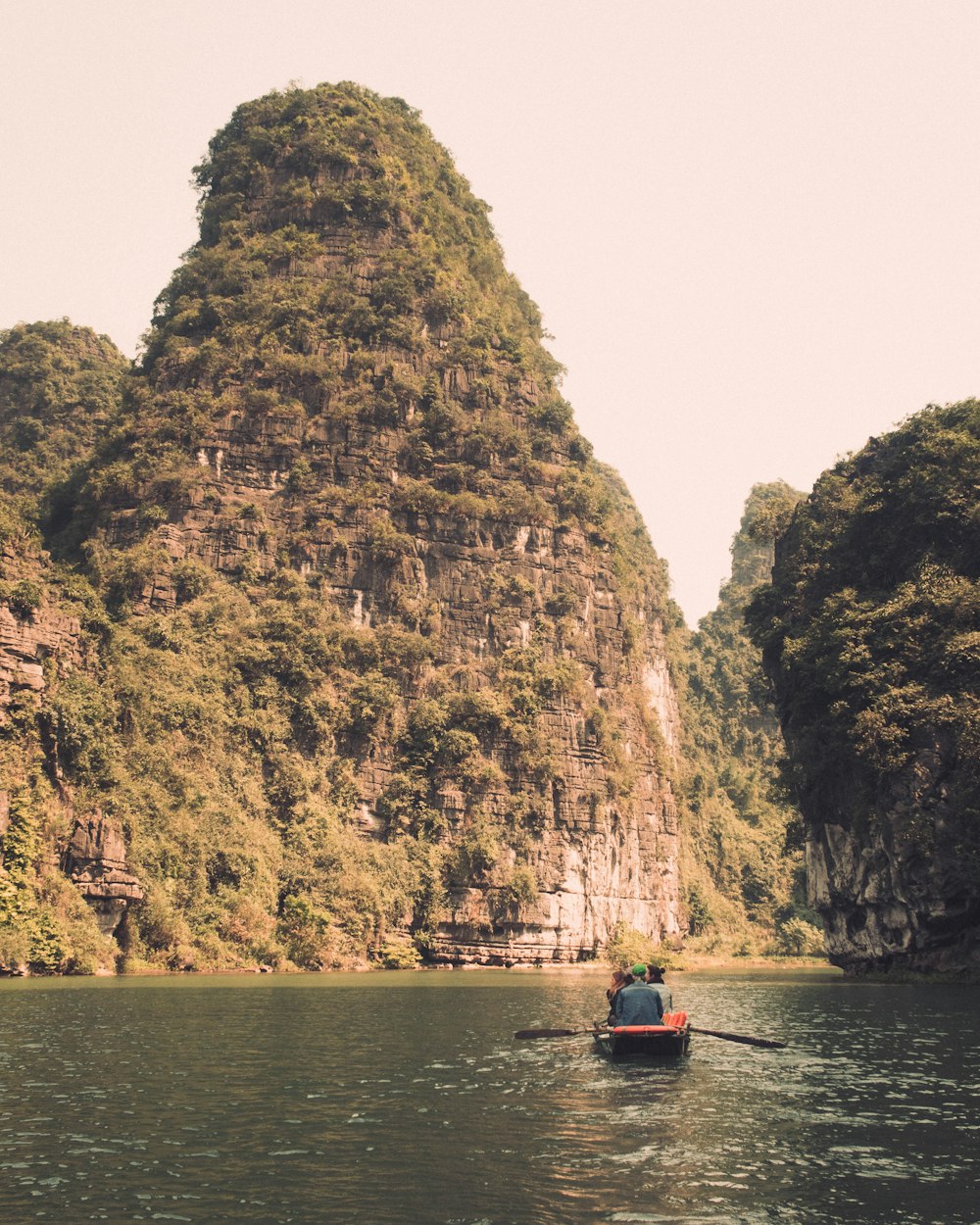 person riding on boat on river during daytime