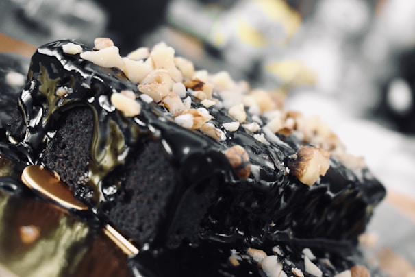 A close-up of a decadent chocolate cake with intricate decorations.