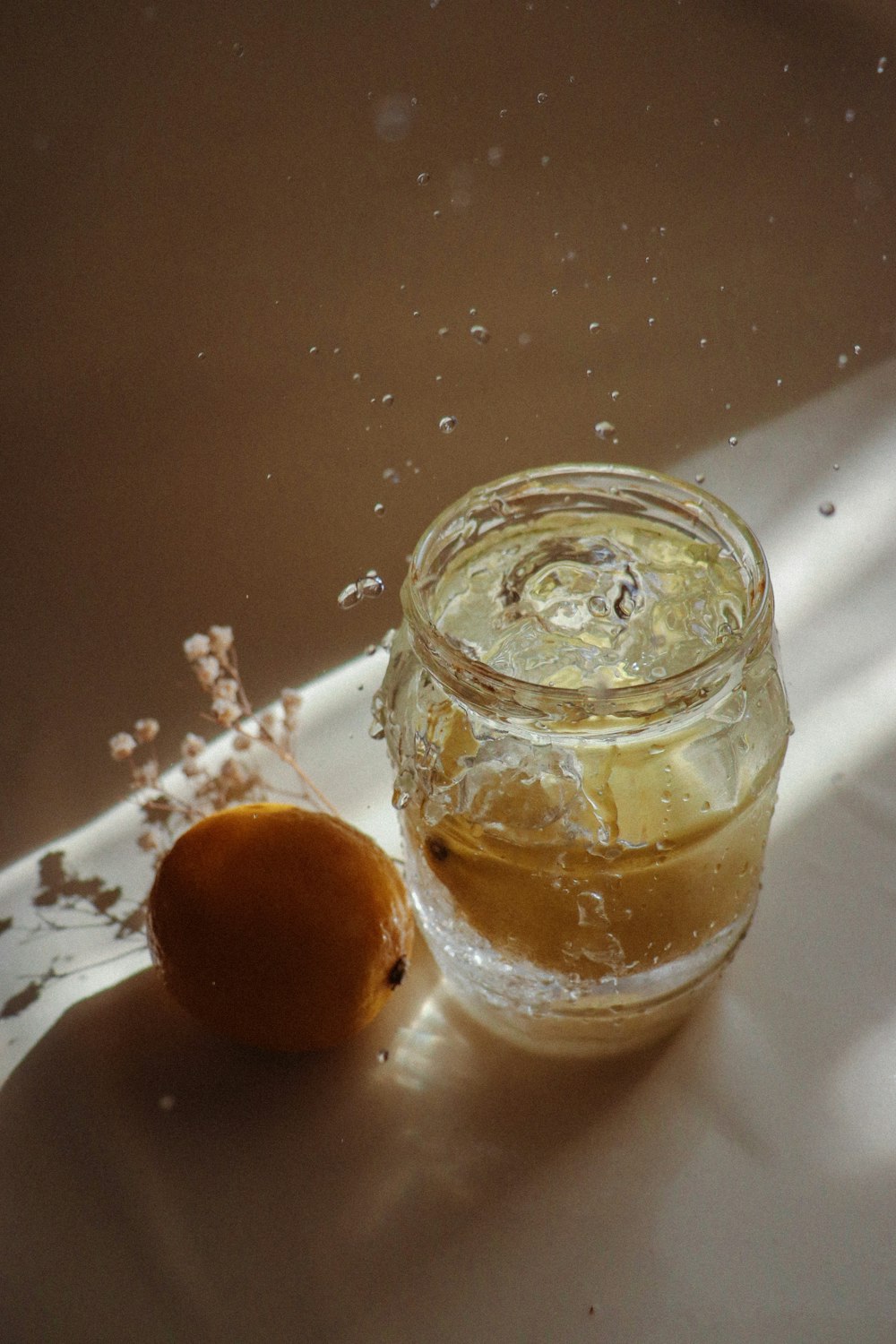 clear glass jar with brown liquid