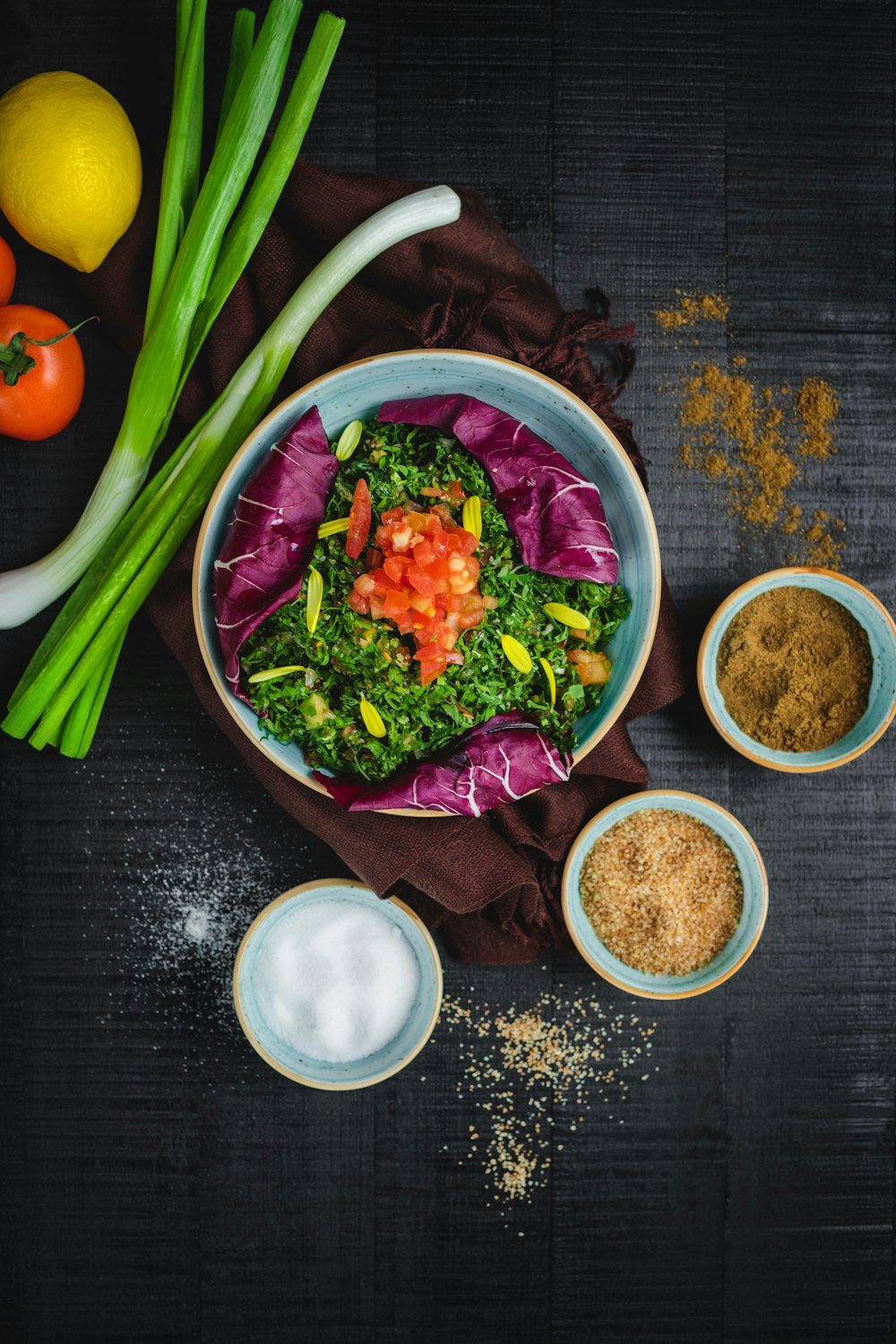 vegetable salad in bowl beside sliced bread and orange fruit