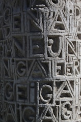 Before and after image showing a restored gravestone with crisp, clear lettering.