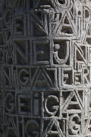 Close-up of intricate Viking runes blending seamlessly with ancient Egyptian hieroglyphs carved into stone.