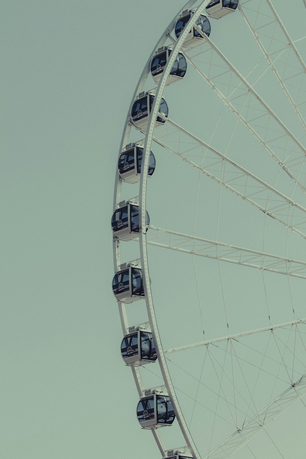 white ferris wheel under blue sky during daytime