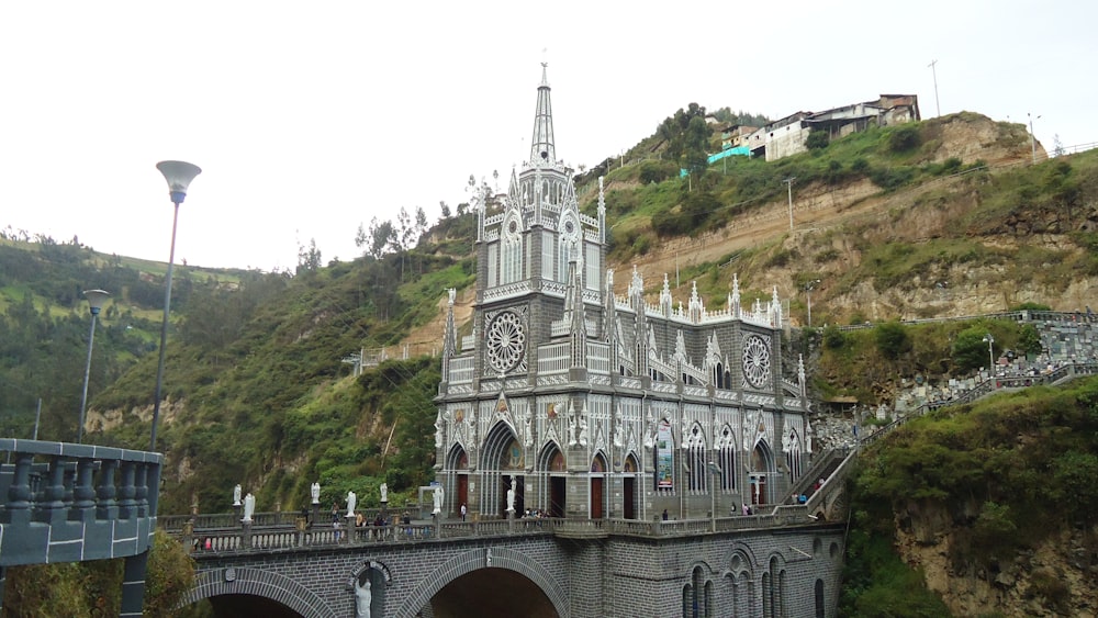 white concrete building on hill