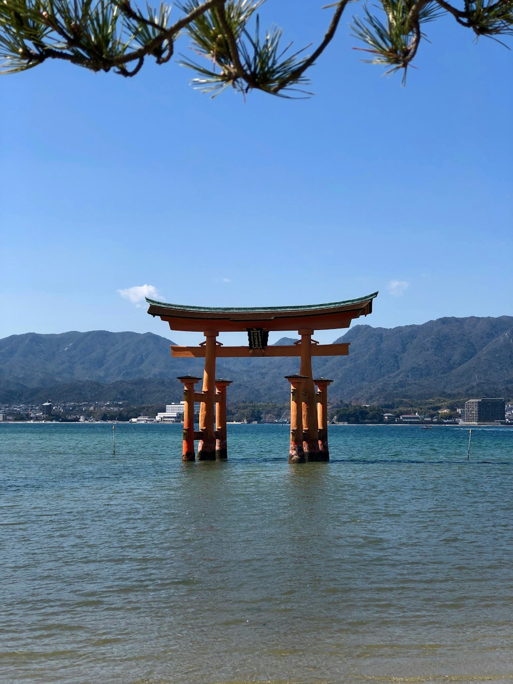 brown wooden tower on body of water during daytime