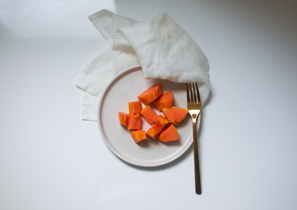 sliced carrots on white ceramic plate